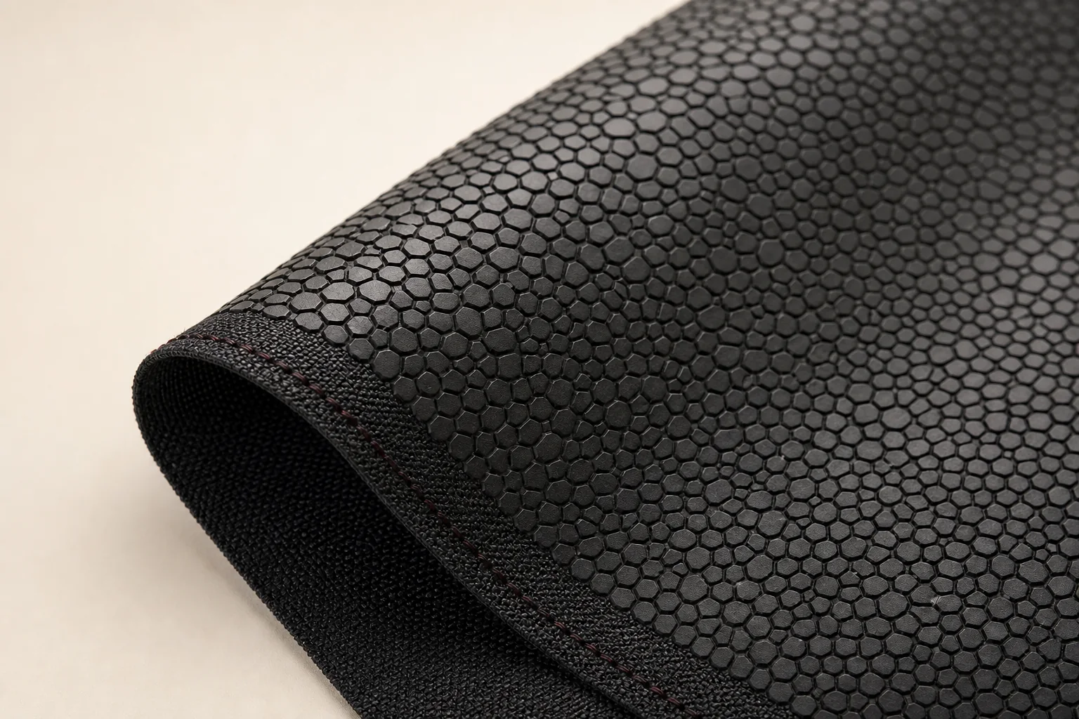 Close-up of protective guard plates bonded to flexible woven textile
